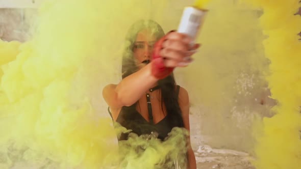 Young Brunette Holding Smoke Grenade