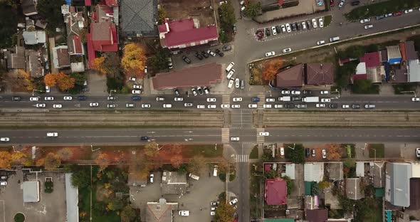 Top Down Drone Point of View - Steet City Road Intersection in Autumn Time