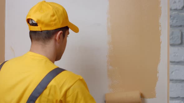 Builder Paints White Wall.