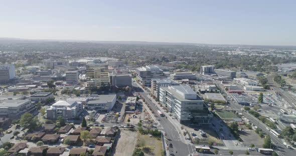 Dandenong City from aerial perspective with many public buses moving through the main streets below.