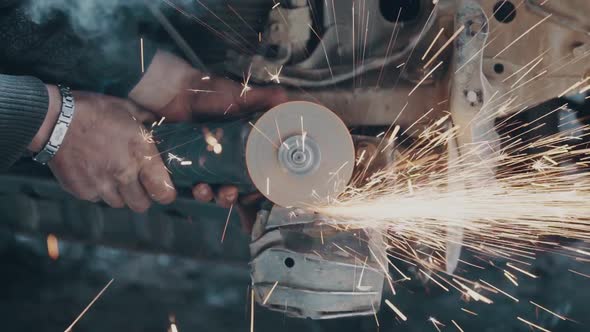 Man grinding steel 