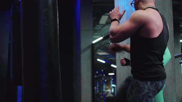 Woman Having a Boxing Training with a Coach  the Coach Talking and Showing the Moves