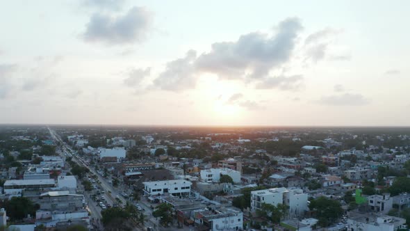 Top Down View of Beautiful City of Tulum in Mexico with Houses and Vehicles Running on Road During