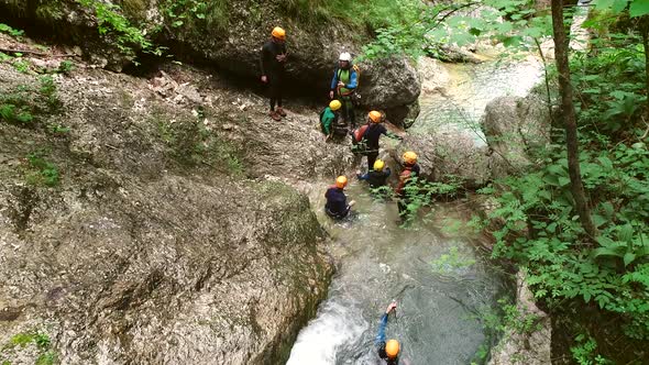 Aerial view of a group of people canyoning in Soca river, Slovenia.