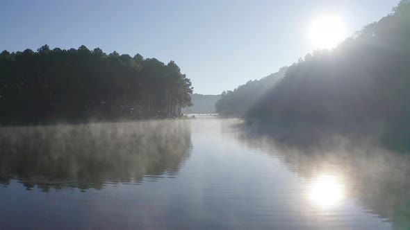 Fog or mist on lake with forest trees in Pang Ung reservoir, Mae Hong Son, Thailand