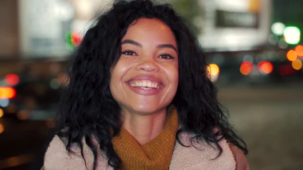 Headshot Portrait of Happy Afro American Young Woman Outside Smiling to Camera