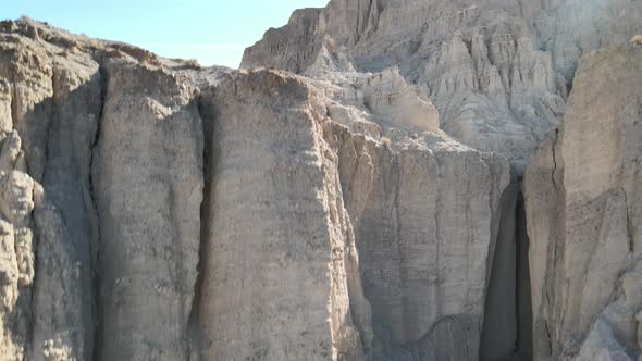 A drone climbs upward to reveal some unique rock formations of the Afton Canyon, in the Mojave Deser