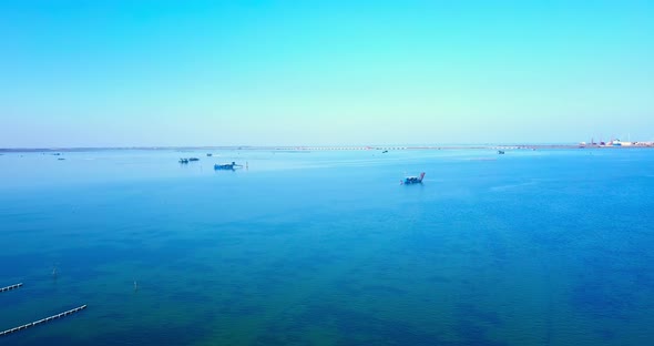 Boat By Nets for Industrial Shellfish Farming on Blue Lagoon