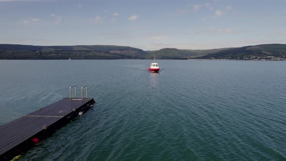 A Small Ferry Arriving into Port in the Summer