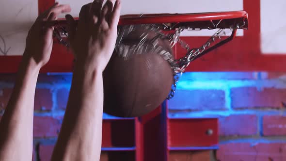 Young Man Training Basketball Skills and His Slam Dunk on the Playground