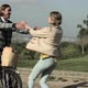 Young woman runs to boyfriend with bike and they kiss - VideoHive Item for Sale
