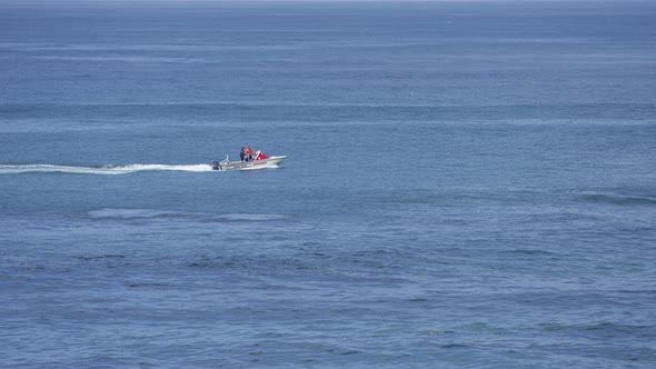 Riding a motorboat in the ocean alt