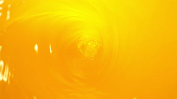 Super Slow Motion Shot of Orange Juice Whirl at 1000 Fps