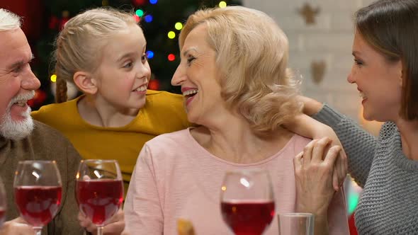 Family Chatting and Joking at Christmas Dinner Happy to Meet for Holidays