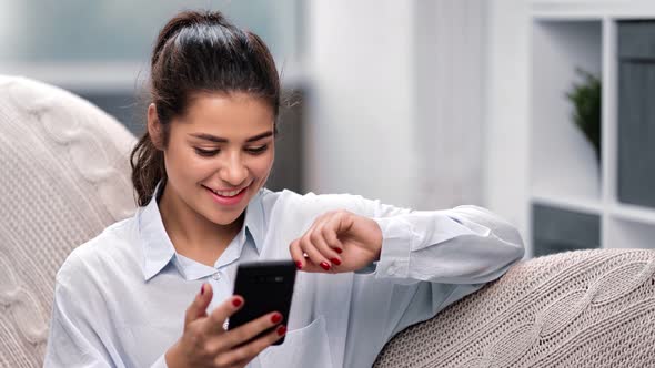 Happy Focused Mixed Race Young Woman Chatting Use Smartphone