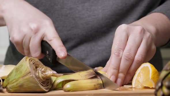 Woman Cut Artichoke