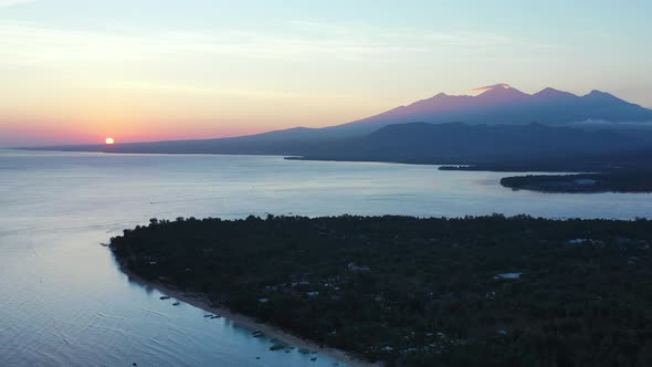 Aerial , the Gili Islands off the coast of Lombok, Indonesia, at sunset. The Gilis are the most popu