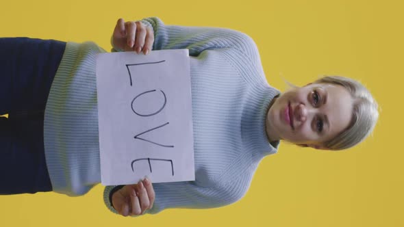 Woman Holding Love Sign