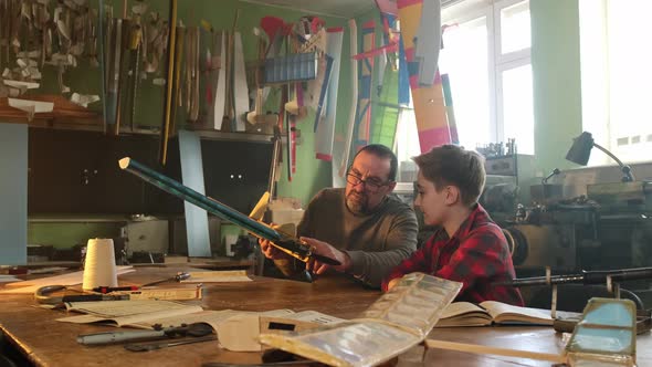 Teacher Helps a Boy Build an Airplane