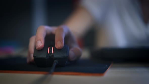 A Man Clicking Digital Mouse and Working on Computer