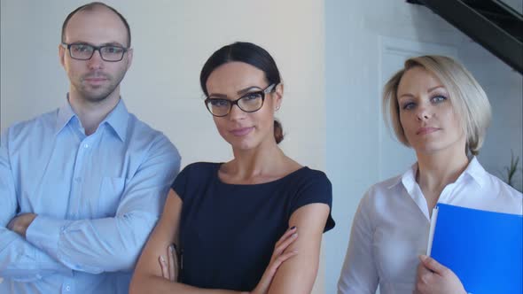 Portrait of Business Team Looking at Camera