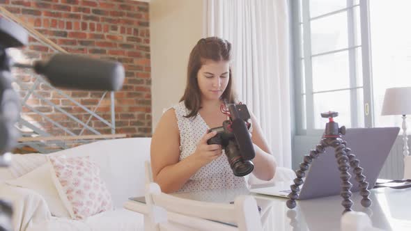 Caucasian blogger woman doing video montage at home