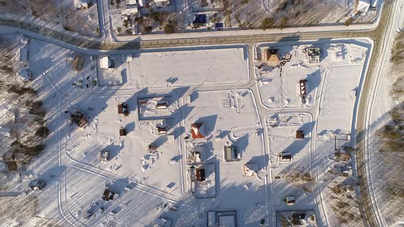 Top down aerial drone view of Winter cottage village located among forests 02