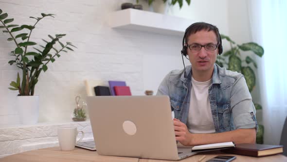 Businessman Making Video Call Looking at Camera and Talking Discussing Strategy Partners Online