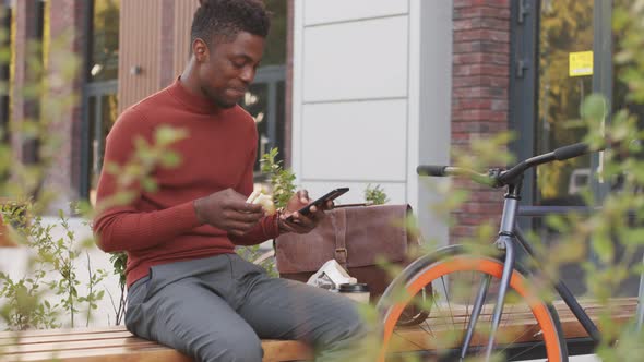 African American Man Having Lunch Break Outdoors