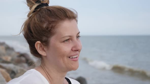 Slow motion of woman on sandy beach relaxing  before sunset  1920X1080 FullHD footage - Female enjoy