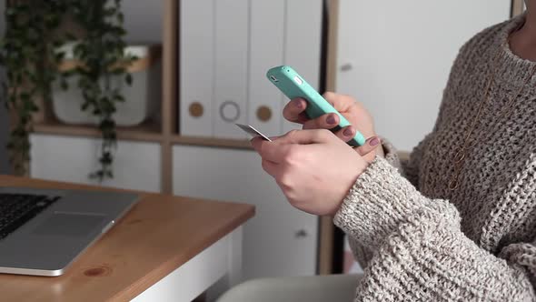 Young Woman Buys Online Using her Phone