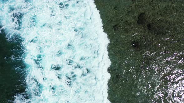 Wide angle overhead copy space shot of a summer white paradise sand beach and aqua blue ocean background