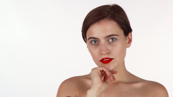 Stunning Red Lipped Brunette Woman Looking Thoughtfully To the Camera