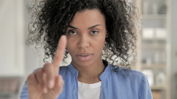 No, African Woman Rejecting Offer By Waving Finger