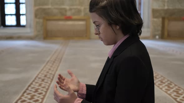 Little Child Praying On Mosque