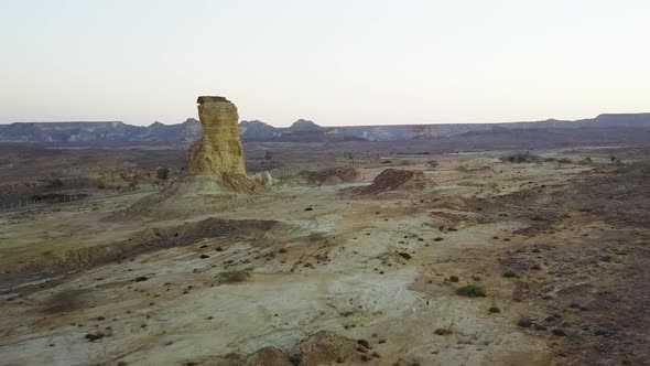 Chimney Rock spire is made up of yellow Entrada sandstone capped by Todilto limestone. Sistan & Balu