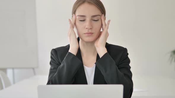 Close Up of Young Businesswoman with Headache Working on Laptop