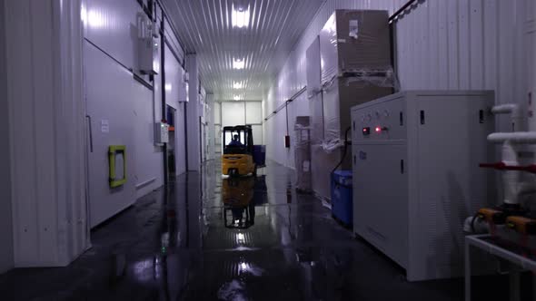 Worker In a Factory Using A Forklift Truck