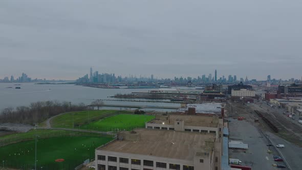 Fly Above Buildings and Sports Fields in Sunset Park Neighbourhood