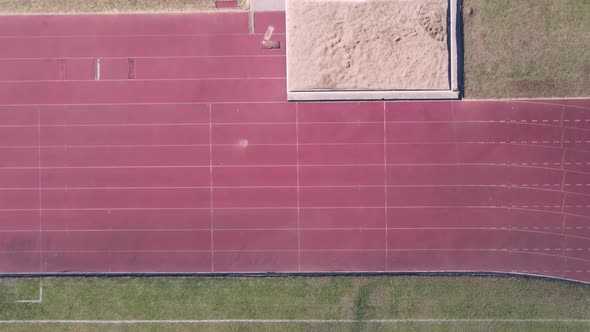 Drone Flying Over Running Turn Seen From Directly Above