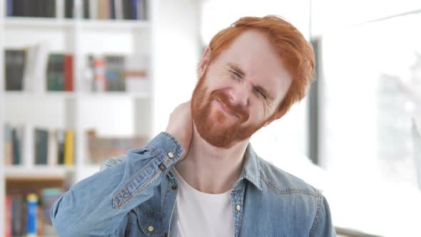 Casual Redhead Man with Neck Pain