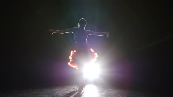 Lady Dancing Samba in the Studio on a Dark Background, Smoke, Silhouette