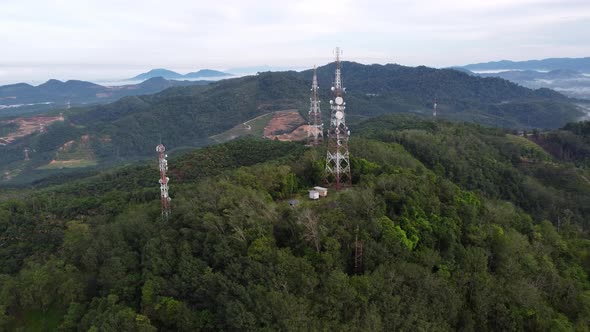 Aerial rotating view three telecom tower