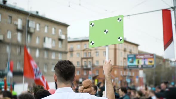 Young Adult Guy on Demonstration with a Blank Poster. Chroma Key Tracking Point.