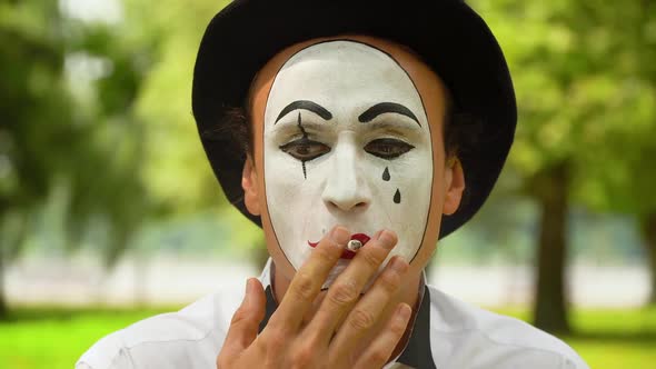 Mime in a Black Hat Smokes Outdoors,Bad Habits