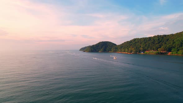 A fisherman is sailing in the sea among the islands near the coast.