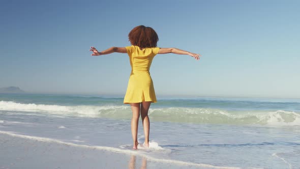 African American woman enjoying seaside