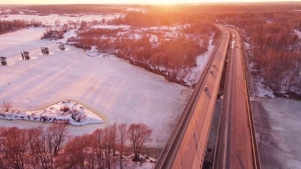 Beautiful Winter Landscape with a Road Bridge at Sunset Aerial View