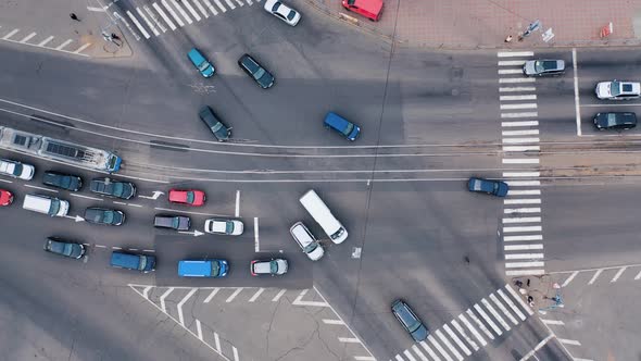 The movement of cars at a crossroads in a small town.