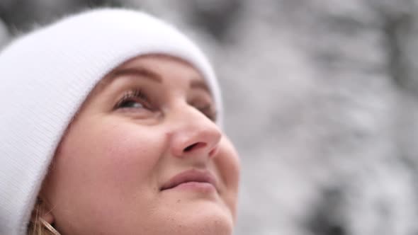 The Face of a Beautiful Girl in Slow Motion Looking at the Sky